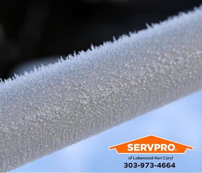 A frozen pipe is covered with ice.